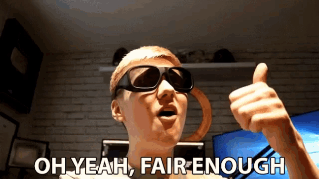 a man wearing 3d glasses is giving a thumbs up with the words oh yeah fair enough behind him