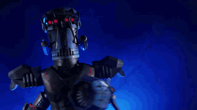 a robot stands in front of a recycling symbol