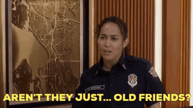 a woman in a police uniform is standing in front of a map and says aren 't they just ... old friends ?