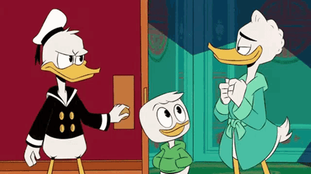 donald duck , daffy duck , and ducky duck are standing next to each other in a room .