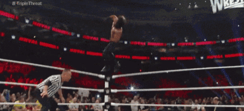 a wrestling match is being shown on the triple threat channel