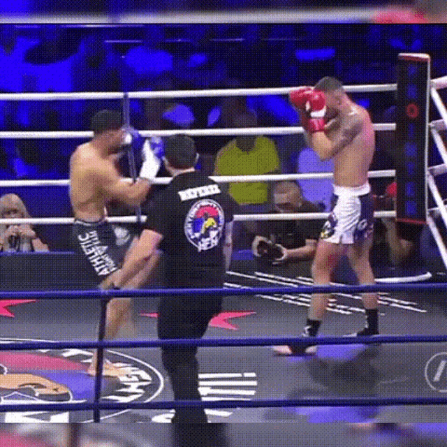 a referee wearing a shirt that says never give up