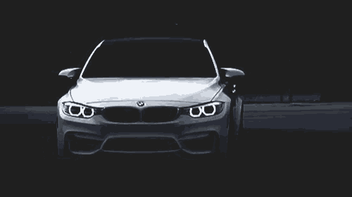 a white bmw with the word art of the automobile on the bottom right