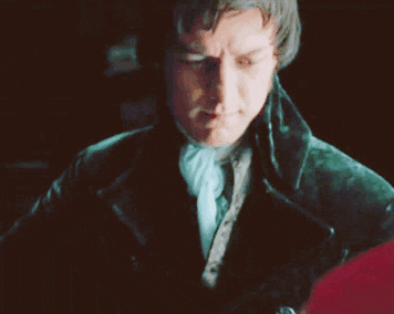 a close up of a man in a green jacket