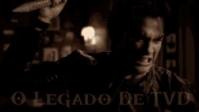 a woman is standing in a room with a sign that says o legado de tvd on it