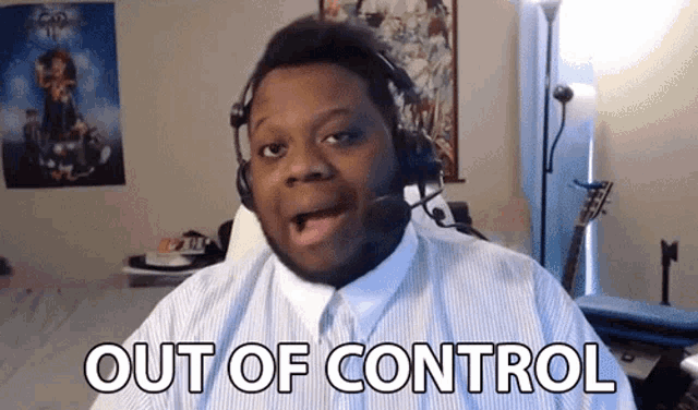 a man wearing headphones says out of control while looking at the camera