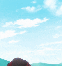 a person covering their face with their hands and a blue sky in the background