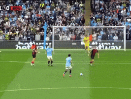 soccer players on a field with a sign that says ' bbva ' on it