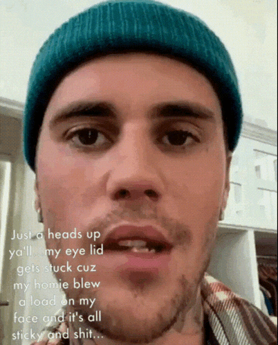 justin bieber is wearing a blue beanie and has a beard