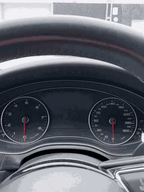 a close up of a car 's dashboard showing the speedometer at 300