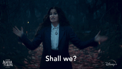 a woman in a suit says " shall we "