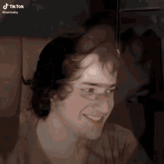 a man 's face is shown in a tik tok video