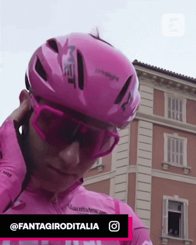 a person wearing a pink helmet and sunglasses with the hashtag fantagiroditalia