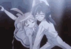 a man and a girl are dancing together in a dark room .