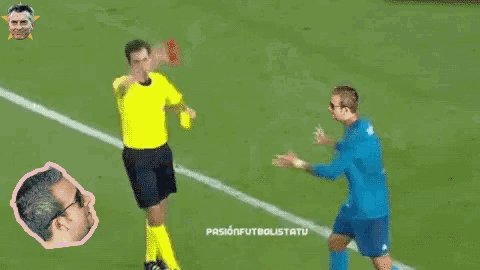 a soccer player with the number 17 on his jersey is getting a red card