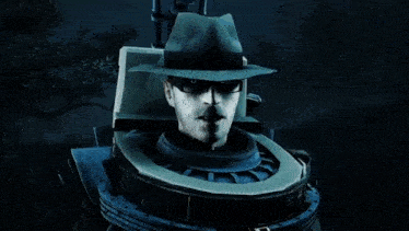 a man in a hat and glasses is sitting in a machine