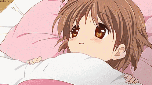 a girl with brown hair is laying in bed with a pink pillow and a white blanket