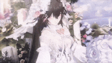 a bride in a wedding dress is standing in front of a bouquet of flowers .