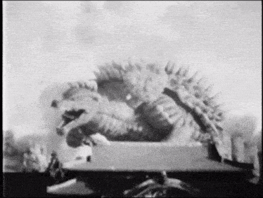 a black and white image of a monster with spikes