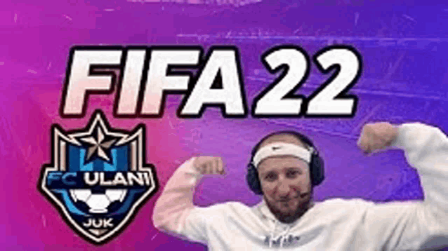 a man wearing headphones and a headband is flexing his muscles in front of a sign that says fifa 22 .