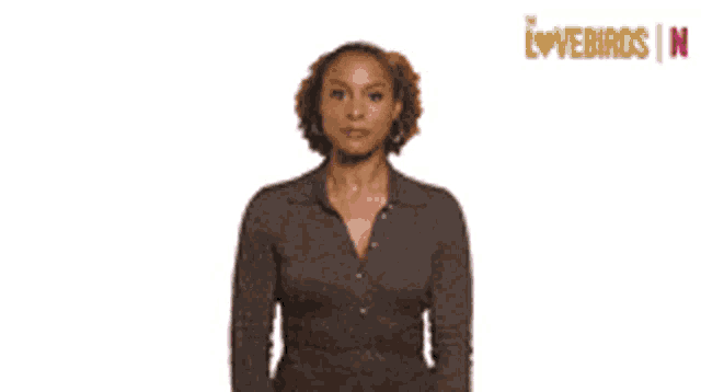a woman is blowing a kiss with a pink lip print behind her