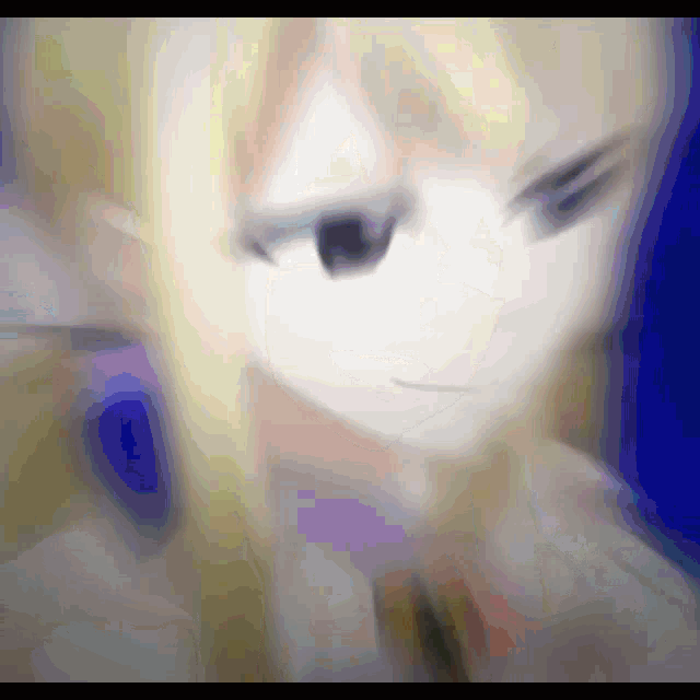 a blurry picture of a girl with blonde hair and a black eye