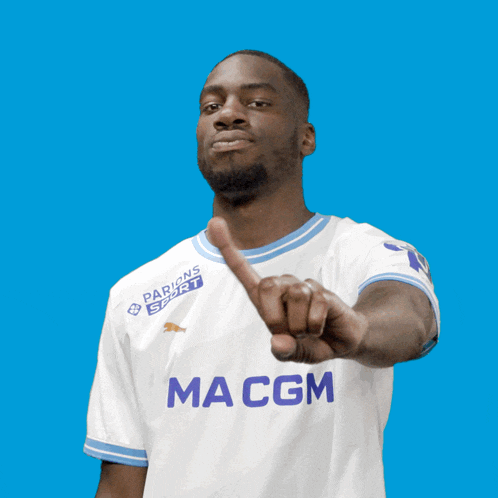 a man wearing a shirt that says macgm
