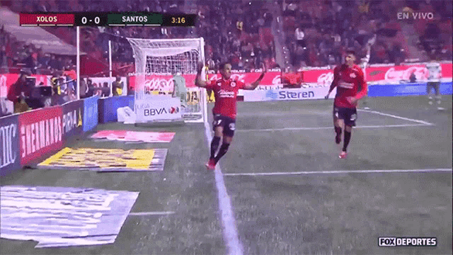a soccer game between xolos and santos is being played