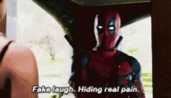 deadpool says fake laugh hiding real pain while looking at a woman