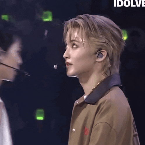 a close up of a person 's face with the word idolve behind them