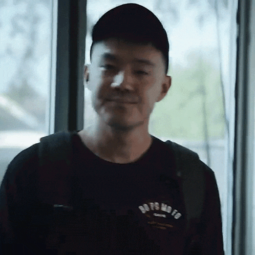 a man wearing a black shirt that says do n't mo fo