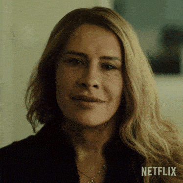 a close up of a woman 's face with netflix written on the bottom right