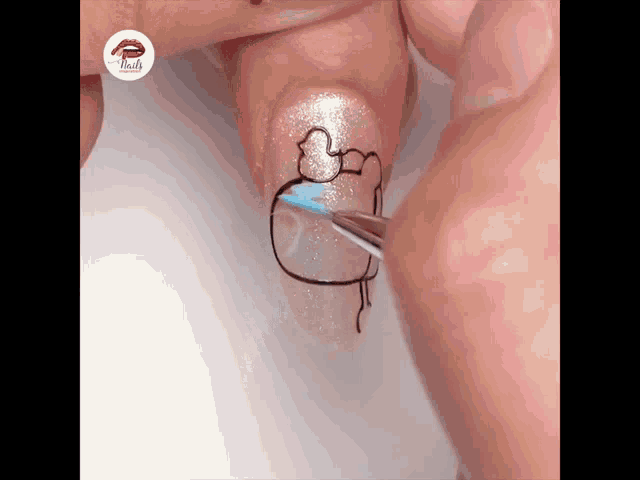 a close up of a person 's nails with a drawing on it