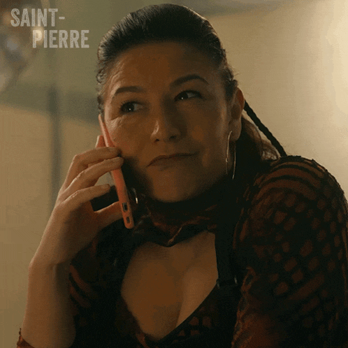 a woman talking on a cell phone with saint-pierre written on the bottom right