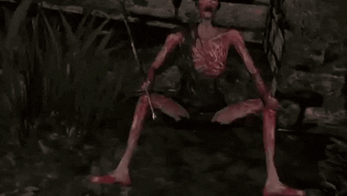 a bloody monster is holding a sword in his hands .