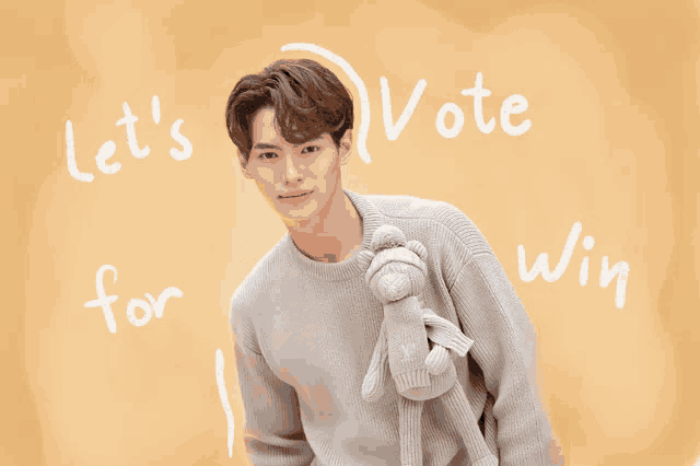 a man in a grey sweater holds a stuffed animal with the words let 's vote for win written behind him