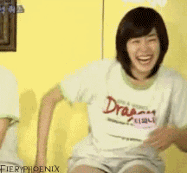 a woman wearing a shirt that says dragon on it