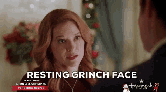 an advertisement for resting grinch face shows a woman talking to a man
