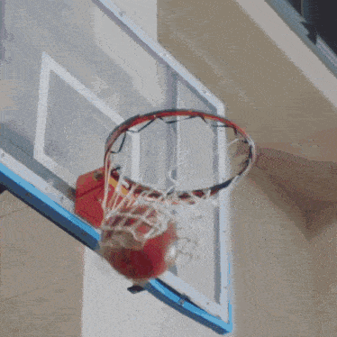 a man wearing a bulls jersey is cheering