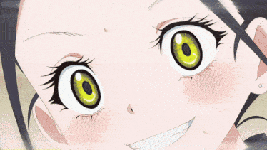 a close up of a girl 's face with green eyes and a smile