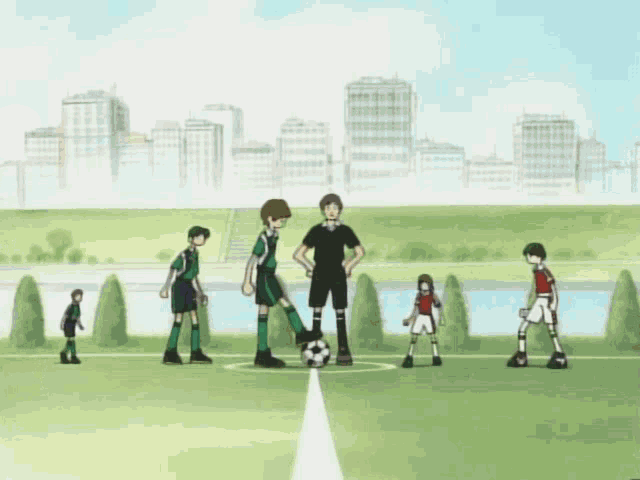 a group of soccer players on a field with a referee