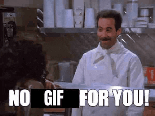 a man in a white chef 's coat is standing in a kitchen talking to a woman .