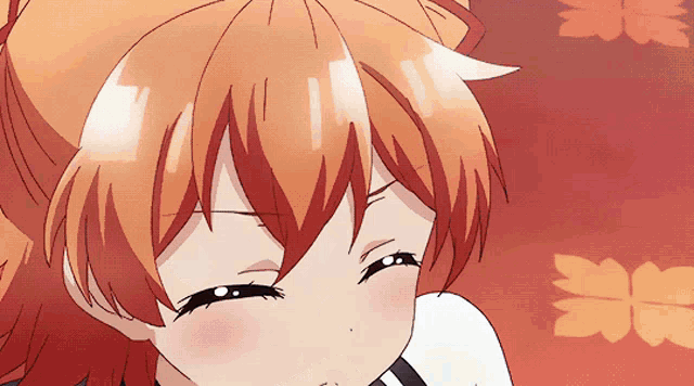a close up of a girl 's face with orange hair
