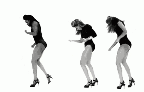 a woman in a black leotard and high heels is dancing .