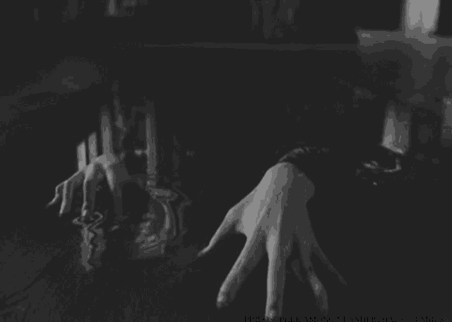 a black and white photo of a person 's hand with the words philosopher among neanderthals tumblr visible
