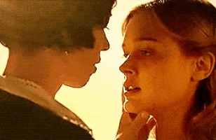 a woman is touching the face of another woman