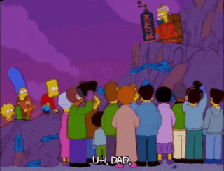 a group of people are standing in front of a statue that says scorpion