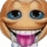 a close up of a smiley face with its tongue hanging out .