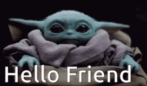 a baby yoda is sitting in a blanket and says hello friend