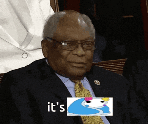 a man in a suit and tie is sitting in front of a picture that says it 's on it